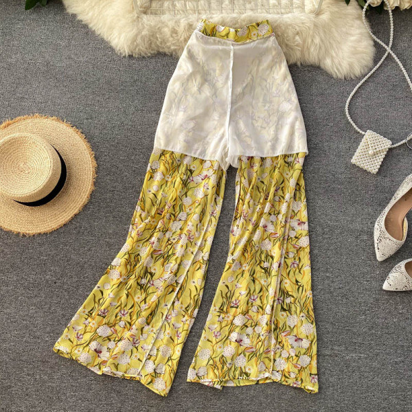 Värviline naiste ülikond koos pükste ja topiga