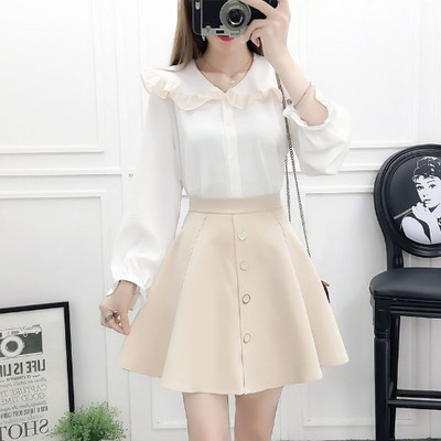 Moderan ženski komplet od dva dijela košulje s okruglim izrezom i izrezane suknje