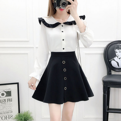 Moderan ženski komplet od dva dijela košulje s okruglim izrezom i izrezane suknje