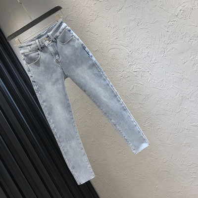 Sinist värvi tasku ja kõrge vöökohaga naiste teksad