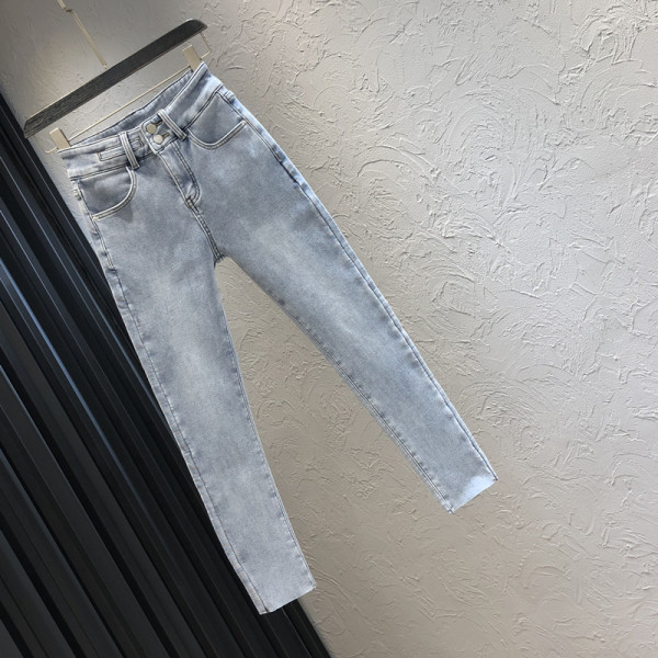 Sinist värvi tasku ja kõrge vöökohaga naiste teksad