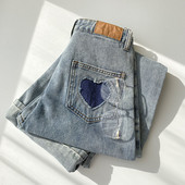 Naiste vabaaja teksapükste lai nööpidega mudel