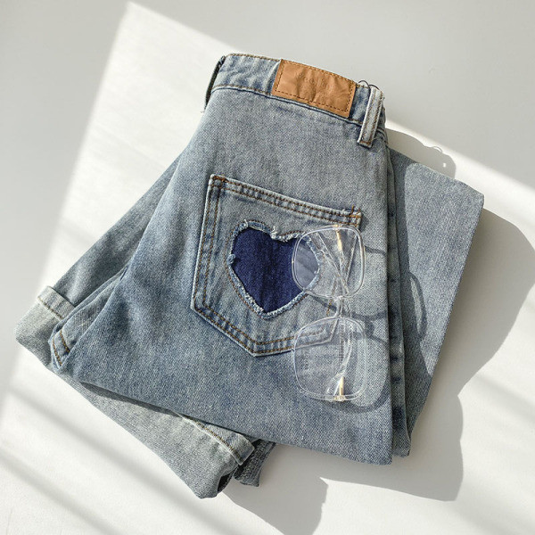 Naiste vabaaja teksapükste lai nööpidega mudel