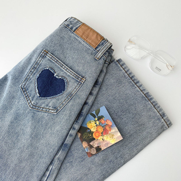 Naiste vabaaja teksapükste lai nööpidega mudel