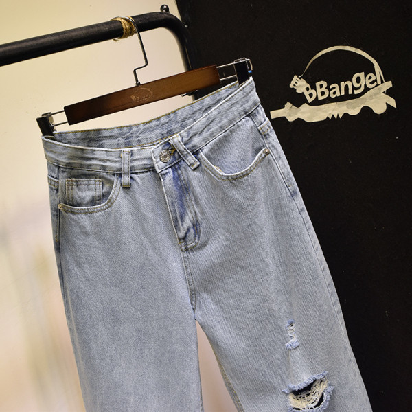 Moodsad naiste asümmeetrilised rebenenud motiividega teksad