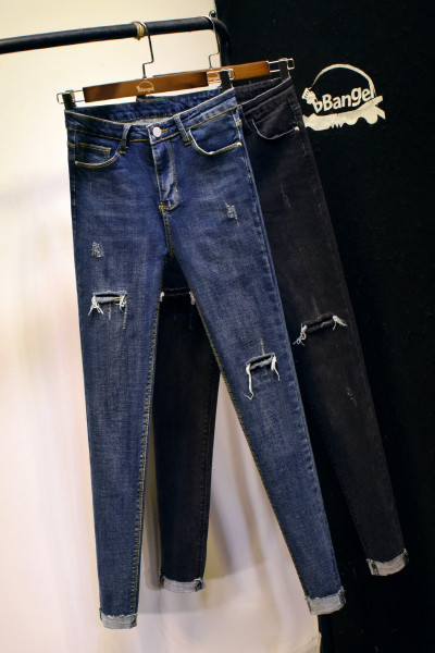 Uus rebenenud kõrge vöökoha motiividega naiste teksapükste mudel