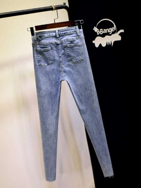 Õhukese mudeli naiste nööpidega teksad – kõrge vöökoht