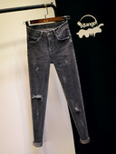 Нов модел вталени дамски дънки в сив цвят със скъсани мотиви