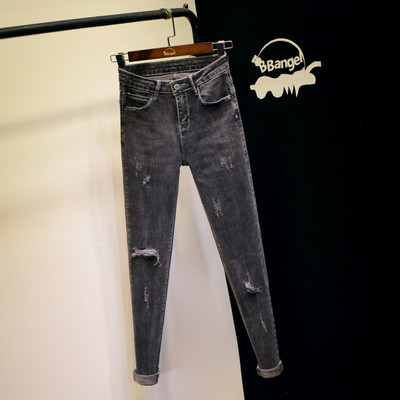 Нов модел вталени дамски дънки в сив цвят със скъсани мотиви