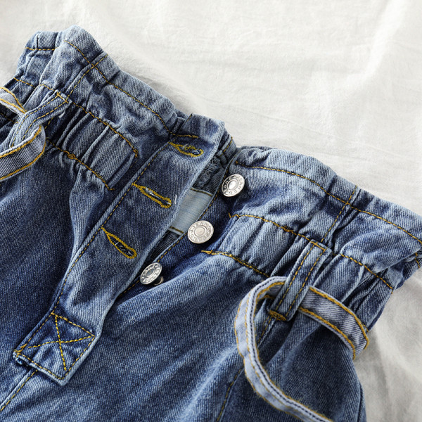 Naiste laiad teksad vöö ja nööpidega