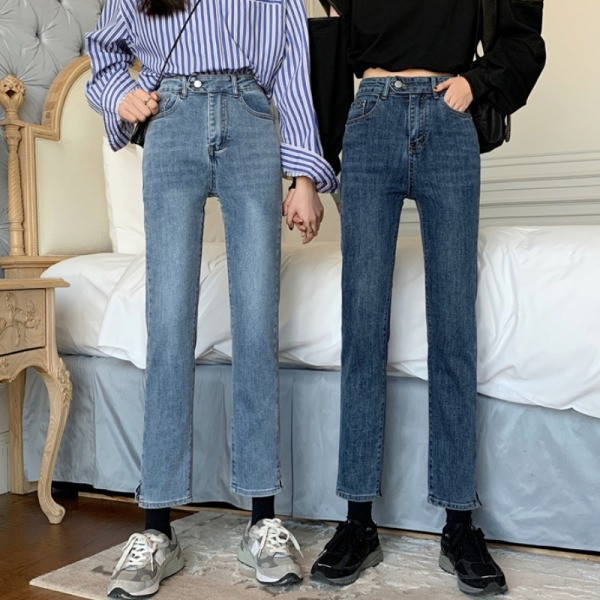 Moodsad nööbi ja kõrge vöökohaga naiste teksad