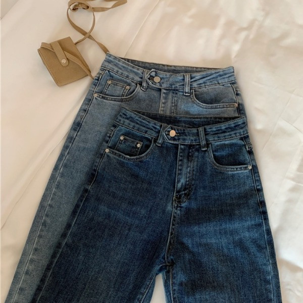 Moodsad nööbi ja kõrge vöökohaga naiste teksad