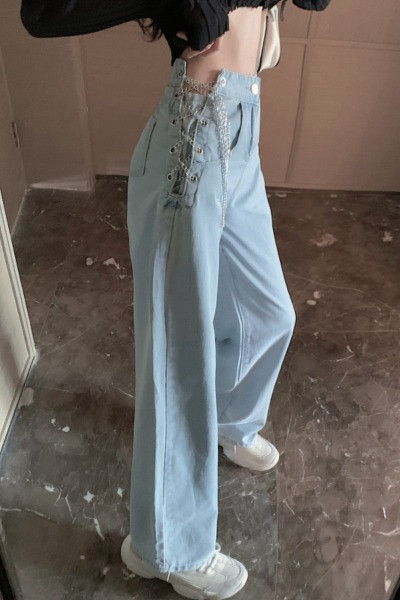 Дамски дънки в светлосин цвят и кръстосани връзки