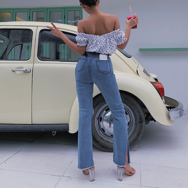 Kõrge vöökoha ja rebenenud motiiviga naiste teksad