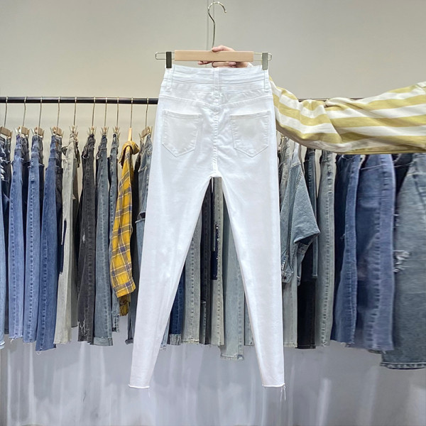 Naiste kõrge vöökohaga teksad – valget värvi