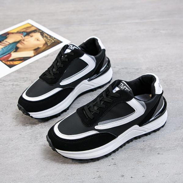 Sportlik-vabaaja naiste tossud valgete ja mustade paeltega