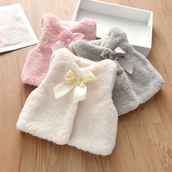 Pūkinė vaikiška liemenė su kaspinu tinka mergaitėms