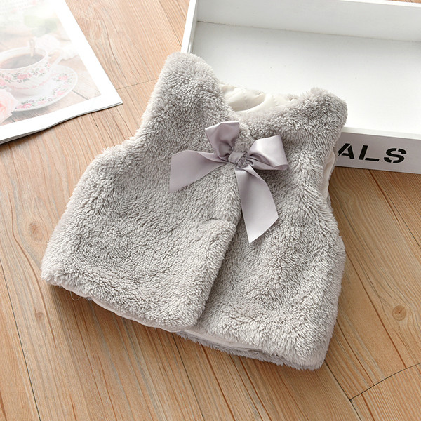 Pūkinė vaikiška liemenė su kaspinu tinka mergaitėms