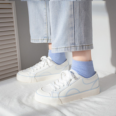 Platnene ženske tenisice s vezicama i ravnim potplatom