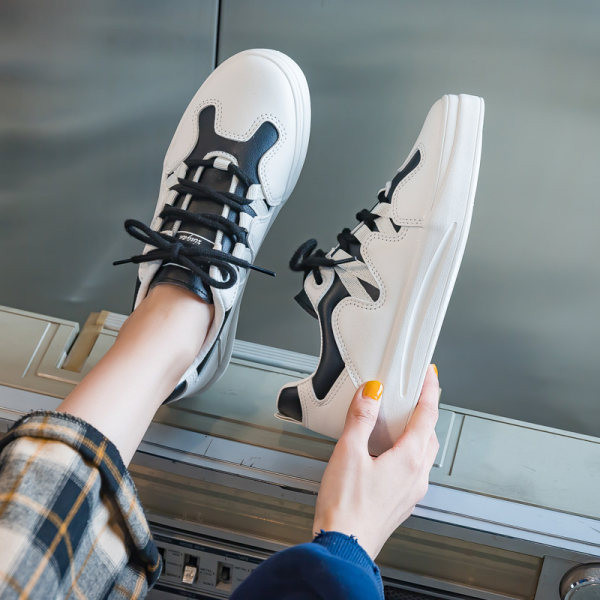 Ženske ležerne tenisice u dvije boje sa vezicama i ravnim đonom