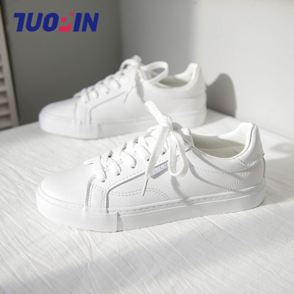 Ženske platnene tenisice sa vezicama i ravnim đonom - bijele boje