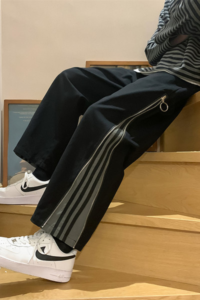 Muški široki model hlača s rubom i patentnim zatvaračem