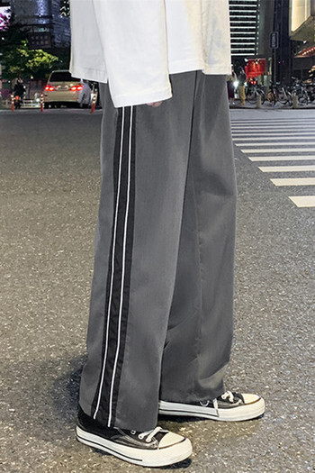 Ανδρικό παντελόνι - απλό φαρδύ μοντέλο με μπορντούρα