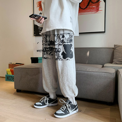 Muške sportsko-elegantne hlače s aplikacijom