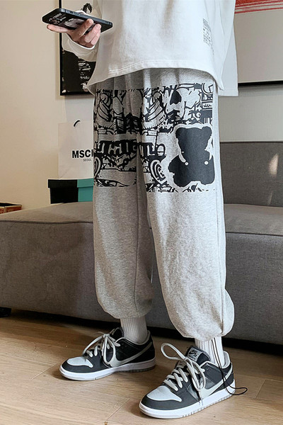 Muške sportsko-elegantne hlače s aplikacijom