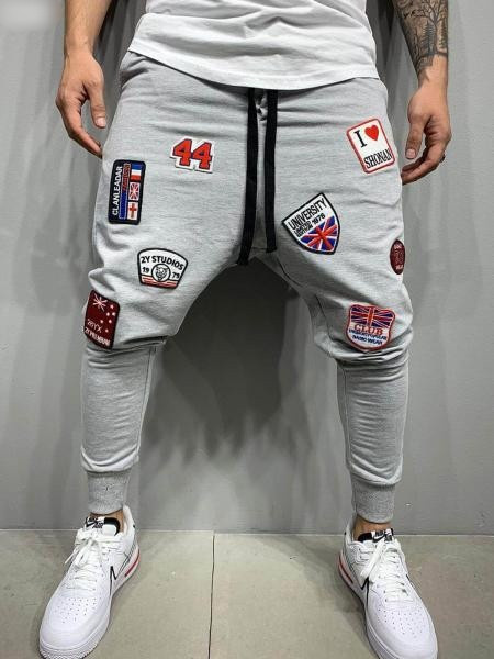 Vīriešu sportiski elegantas bikses ar aplikācijām un saitēm