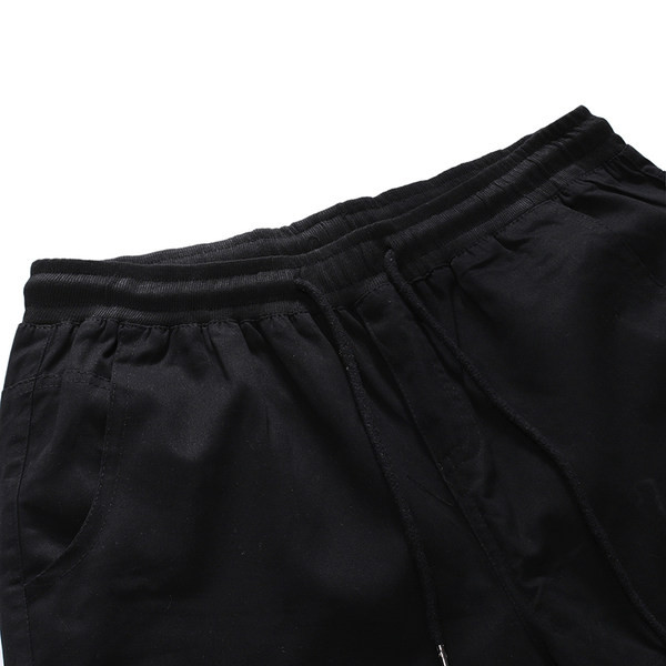 Μοντέρνο ανδρικό παντελόνι με τσέπες και κορδόνια