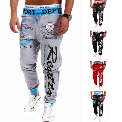 Men`s sports pants with applique and inscriptions