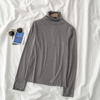 Sieviešu blūzes vienkāršs modelis ar augstu apkakli