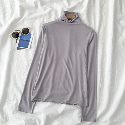 Sieviešu blūzes vienkāršs modelis ar augstu apkakli