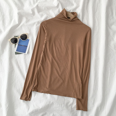 Sieviešu blūzes vienkāršs modelis ar augstu apkakli