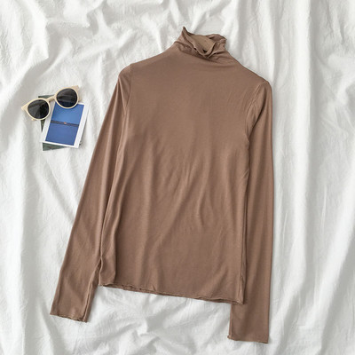 Sieviešu blūzes vienkāršs modelis ar augstu apkakli