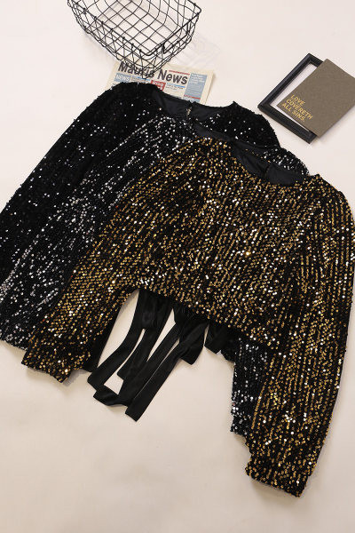 Sjajna ženska bluza sa šljokicama i okruglim izrezom