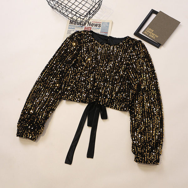 Sjajna ženska bluza sa šljokicama i okruglim izrezom