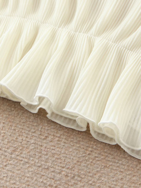 Κοντή γυναικεία μπλούζα με ελαστική μέση και βολάν