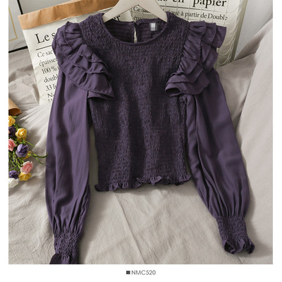 Μοντέρνα γυναικεία μπλούζα με στρογγυλή λαιμόκοψη και βολάν