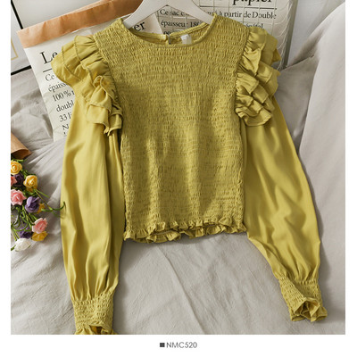 Μοντέρνα γυναικεία μπλούζα με στρογγυλή λαιμόκοψη και βολάν