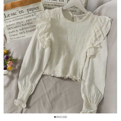 Μοντέρνα γυναικεία μπλούζα με στρογγυλή λαιμόκοψη και βολάν