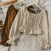 Ženska bluza na točkice s dugim rukavima i vezicama