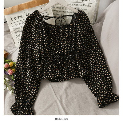 Ženska bluza na točkice s dugim rukavima i vezicama