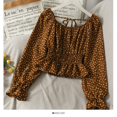 Ženska bluza na točkice s dugim rukavima i vezicama