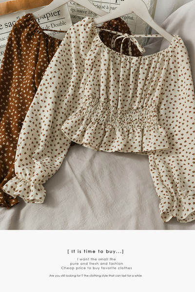 Ženska bluza na točkice s dugim rukavima i vezicama