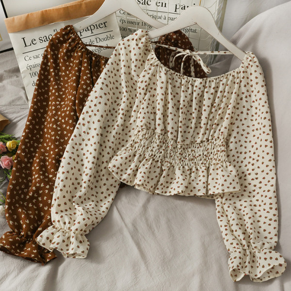 Ženska bluza na točkice s dugim rukavima i vezicama