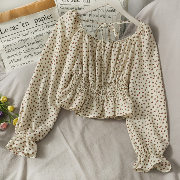 Ženska bluza na točkice s dugim rukavima i vezicama