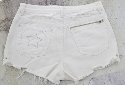 Μοντέρνα γυναικεία τζιν με φερμουάρ και κρόσσια