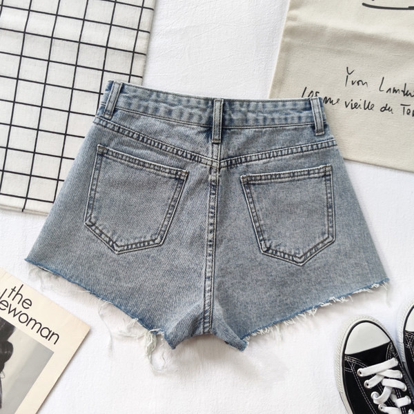 Ženske traper kratke hlače s poderanim uzorkom